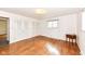 Spacious bedroom featuring wood floors, bright lighting, and convenient access to a large closet at 80 S Richland Ave, Carmel, IN 46032