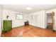 Bedroom featuring hardwood floors, two windows, and a closet at 80 S Richland Ave, Carmel, IN 46032