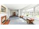 Spacious living room with a fireplace, a large bay window, and traditional décor at 80 S Richland Ave, Carmel, IN 46032