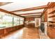 Comfortable living room with wood beams, a fireplace, and a large window for plenty of natural light at 80 S Richland Ave, Carmel, IN 46032