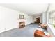 Bright living room with a decorative fireplace, traditional furnishings, and a large window at 80 S Richland Ave, Carmel, IN 46032