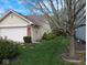 Charming backyard with lush green lawn, mature trees, and a well-maintained exterior; garage visible at 8106 Captain Dr, Avon, IN 46123