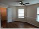 Bedroom featuring wood flooring, a ceiling fan, and windows providing ample natural light at 8106 Captain Dr, Avon, IN 46123