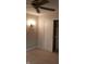 Carpeted bedroom featuring a decorative light fixture and closet with sliding doors for efficient storage at 8106 Captain Dr, Avon, IN 46123