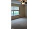 Bedroom with a ceiling fan and natural light from a window at 8106 Captain Dr, Avon, IN 46123