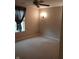 Cozy bedroom with neutral carpeting, window with blinds, decorative wall sconce, and ample space at 8106 Captain Dr, Avon, IN 46123