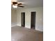 Bedroom featuring carpeted floors and access to closet and bathroom at 8106 Captain Dr, Avon, IN 46123
