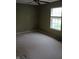 Spacious bedroom featuring neutral carpeting, a ceiling fan, and a window providing natural light at 8106 Captain Dr, Avon, IN 46123