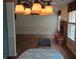 Open dining and living area with wood floors, neutral walls, and a traditional chandelier at 8106 Captain Dr, Avon, IN 46123