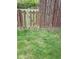 Weathered wooden fence separating the property with green grass on the ground at 8106 Captain Dr, Avon, IN 46123