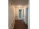 Inviting hallway with stylish flooring, decorative trim, and neutral paint; several doorways visible at 8106 Captain Dr, Avon, IN 46123