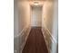 Hallway with wood floors and decorative trim at 8106 Captain Dr, Avon, IN 46123