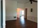 Bright, open living area showcasing hardwood floors, wainscoting, and neutral paint at 8106 Captain Dr, Avon, IN 46123