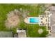 Stunning backyard featuring a swimming pool, lounging area, and surrounding greenery at 8155 Hunt Club Rd, Zionsville, IN 46077