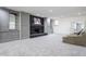 Finished basement with fireplace, built in shelving and seating area at 8155 Hunt Club Rd, Zionsville, IN 46077