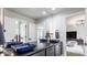 Modern bathroom featuring blue vessel sinks on black countertop and a view of the bedroom at 8155 Hunt Club Rd, Zionsville, IN 46077