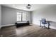 Minimal bedroom featuring hardwood floors, a large window and a desk at 8155 Hunt Club Rd, Zionsville, IN 46077