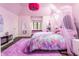 Whimsical bedroom featuring an elaborate canopy bed, large window and a plush carpet at 8155 Hunt Club Rd, Zionsville, IN 46077