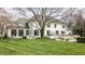 Stunning backyard featuring lush green lawn, a spacious patio, and a luxurious outdoor seating area at 8155 Hunt Club Rd, Zionsville, IN 46077