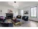 Stunning living room with modern lighting, fireplace, and designer furnishings at 8155 Hunt Club Rd, Zionsville, IN 46077