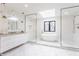 Bright main bathroom with freestanding tub, glass showers, and modern fixtures at 8155 Hunt Club Rd, Zionsville, IN 46077