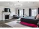 Luxurious main bedroom featuring a fireplace, TV, and elegant decor at 8155 Hunt Club Rd, Zionsville, IN 46077