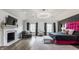 Luxurious main bedroom featuring a fireplace, TV, and elegant decor at 8155 Hunt Club Rd, Zionsville, IN 46077
