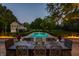 Stunning outdoor pool with a dining table and chairs for entertaining guests at 8155 Hunt Club Rd, Zionsville, IN 46077