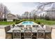 Stunning pool and backyard provide a tranquil oasis with beautiful landscaping and greenery at 8155 Hunt Club Rd, Zionsville, IN 46077