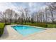 Inviting pool and surrounding patio area offer a perfect setting for outdoor recreation and enjoyment at 8155 Hunt Club Rd, Zionsville, IN 46077