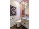Elegant powder room featuring shimmering tile accent wall and vessel sink at 8155 Hunt Club Rd, Zionsville, IN 46077