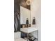 Chic powder room with patterned wallpaper, rectangular mirror, and modern sink at 8155 Hunt Club Rd, Zionsville, IN 46077