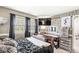 Bedroom featuring dark furniture, black bedding, and a decorative vanity area at 8715 Kensington Dr, Noblesville, IN 46060