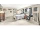 Spacious bedroom with neutral walls, carpet, and a bed with patterned bedspread at 8715 Kensington Dr, Noblesville, IN 46060