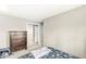 Bedroom with a chest of drawers, mirrored closet, and cozy bedding at 8715 Kensington Dr, Noblesville, IN 46060
