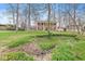 A charming two-story brick home nestled on a sprawling lot with mature trees and natural landscaping at 8715 Kensington Dr, Noblesville, IN 46060