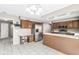 Bright kitchen features stainless steel appliances, tile flooring, and plentiful cabinet space at 8715 Kensington Dr, Noblesville, IN 46060