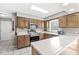 This bright kitchen is equipped with modern appliances, wooden cabinets, and ample counter space at 8715 Kensington Dr, Noblesville, IN 46060