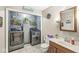 Convenient laundry room with modern washer and dryer, storage cabinet, and a sink at 8715 Kensington Dr, Noblesville, IN 46060