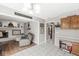 Open floor plan seamlessly connects the living room with kitchen and features a fireplace at 8715 Kensington Dr, Noblesville, IN 46060