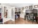 Office room with hardwood floors, built-in shelving, and a large desk, designed for comfort and functionality at 8715 Kensington Dr, Noblesville, IN 46060