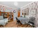 Charming dining room featuring vintage wallpaper, a quaint table set, and a classic china cabinet at 928 Forest Blvd N Dr, Indianapolis, IN 46240