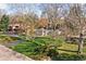 Well-kept single-story home on a large lot with mature trees and a beautiful green lawn at 928 Forest Blvd N Dr, Indianapolis, IN 46240