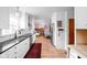 Spacious kitchen with white cabinets, stainless steel appliances, and an open layout at 928 Forest Blvd N Dr, Indianapolis, IN 46240