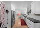 Modern kitchen with stainless steel appliances, white cabinetry, and sleek countertops at 928 Forest Blvd N Dr, Indianapolis, IN 46240