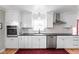 Beautiful white kitchen with stainless steel appliances and ample cabinet space at 928 Forest Blvd N Dr, Indianapolis, IN 46240