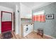 Bright laundry room with white cabinets, butcher block countertop and Miele washer and dryer at 928 Forest Blvd N Dr, Indianapolis, IN 46240
