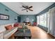 Bright living room with hardwood floors, a large window, and stylish furnishings at 928 Forest Blvd N Dr, Indianapolis, IN 46240