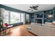 Inviting living room with a fireplace, built-in shelving, and a large window at 928 Forest Blvd N Dr, Indianapolis, IN 46240