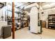 The basement offers ample storage space with shelving units and a clean concrete floor at 933 Tecumseh St, Indianapolis, IN 46201